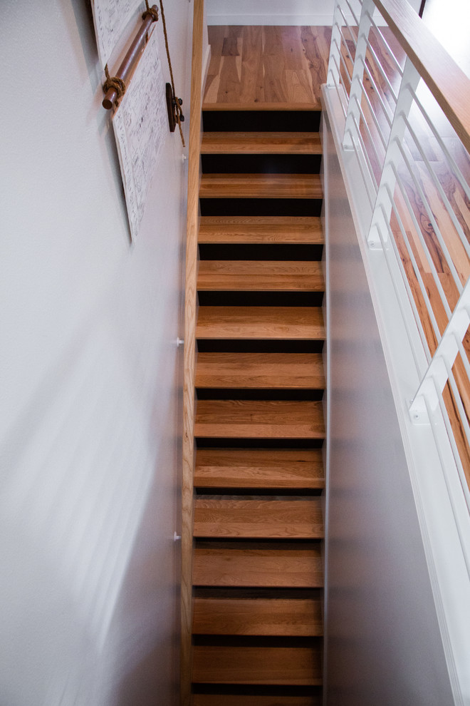 Staircase - mid-sized modern wooden straight metal railing staircase idea in Portland with painted risers