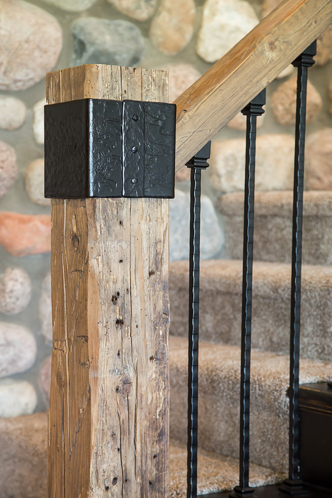 Photo of a medium sized rustic carpeted l-shaped staircase in Other with carpeted risers.