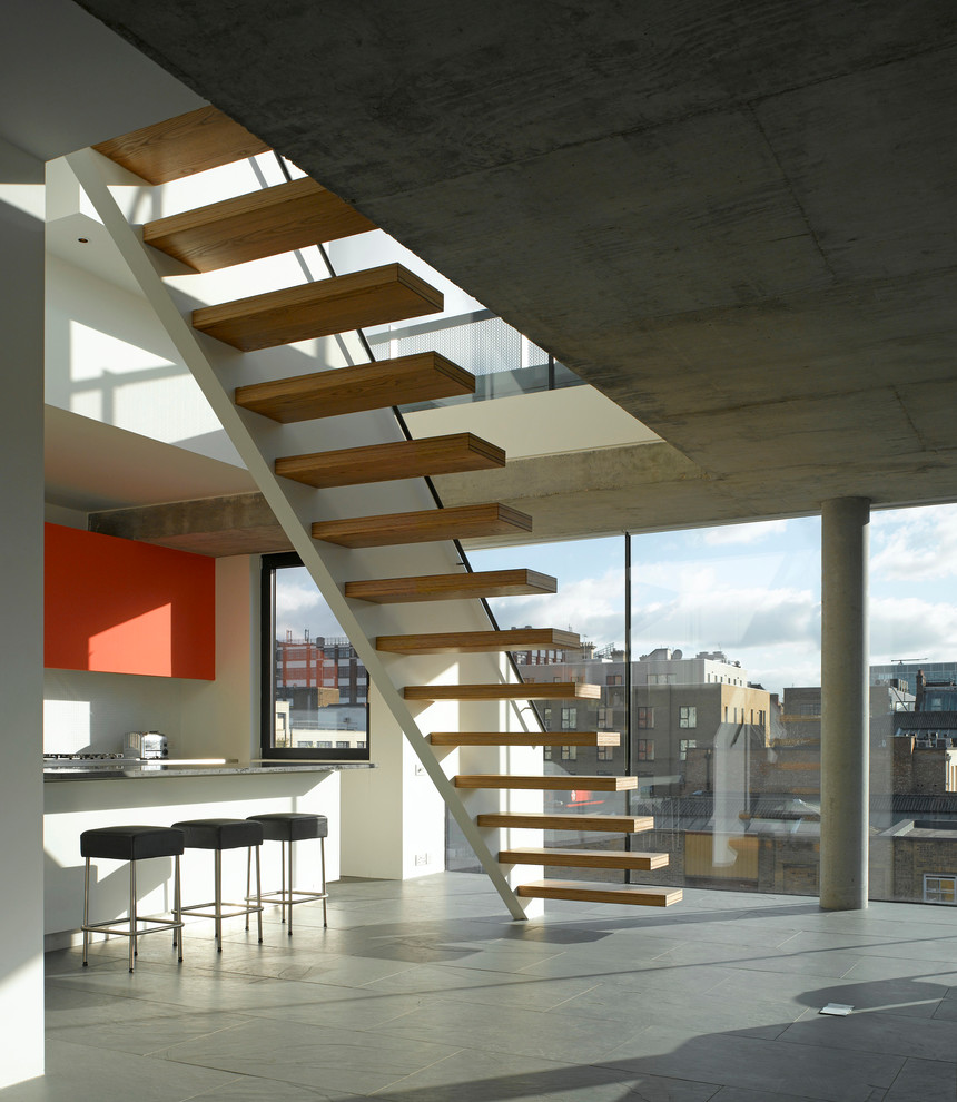 Inspiration for a contemporary wood floating staircase in London with open risers.