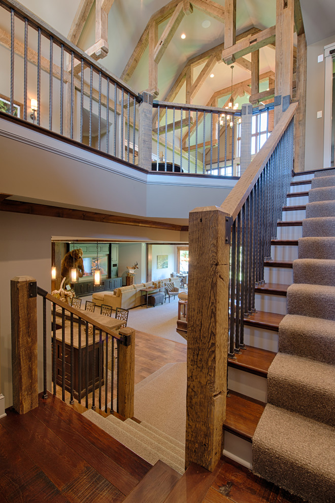 Example of a mid-sized mountain style wooden u-shaped mixed material railing staircase design in Minneapolis with painted risers