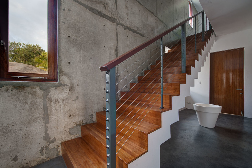 Inspiration for a contemporary wooden straight staircase remodel in Other with wooden risers