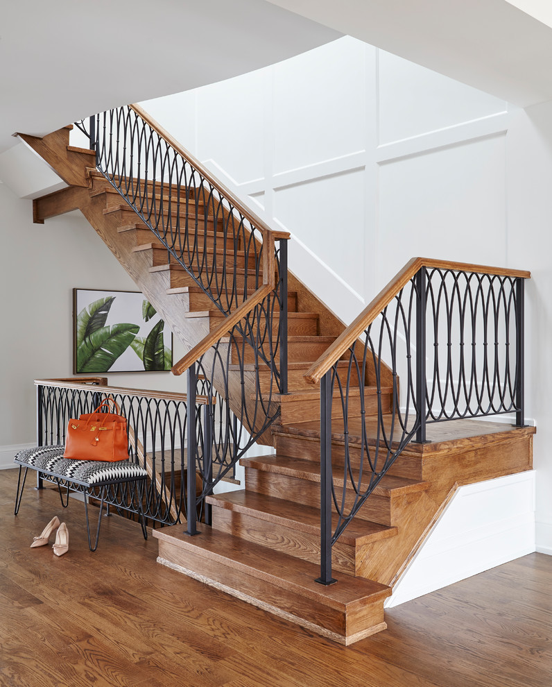 Example of a mid-sized trendy wooden l-shaped metal railing staircase design in Toronto with wooden risers