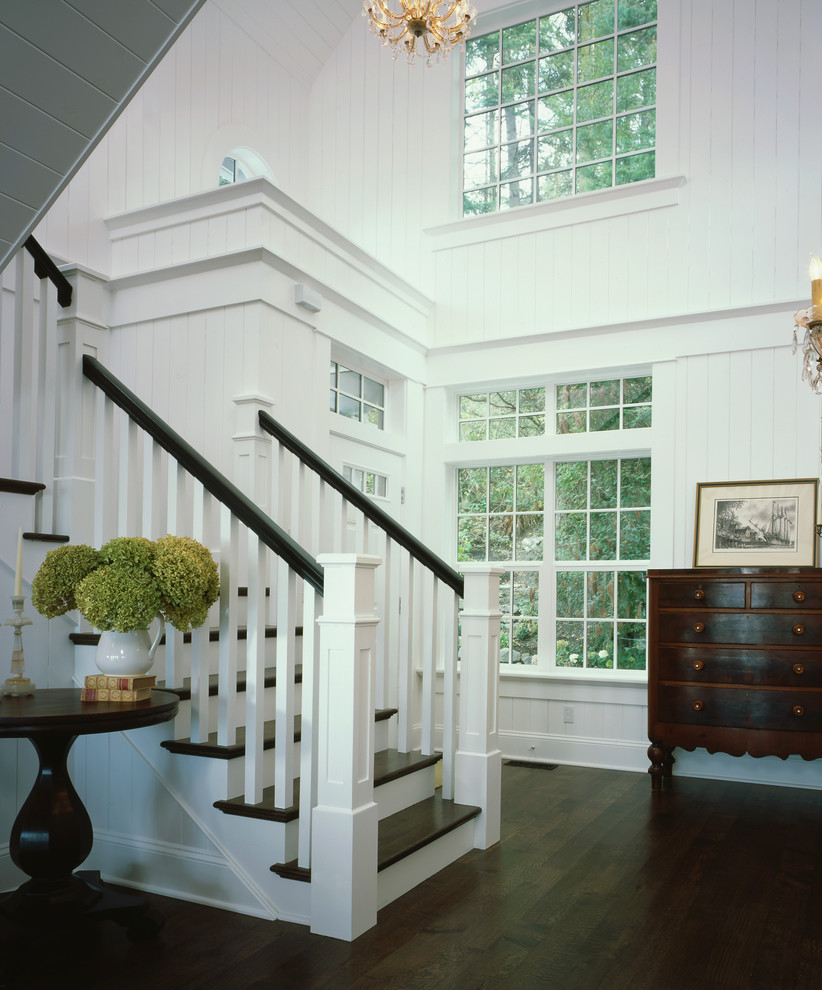 Photo of a medium sized classic wood l-shaped staircase in Seattle with wood risers.