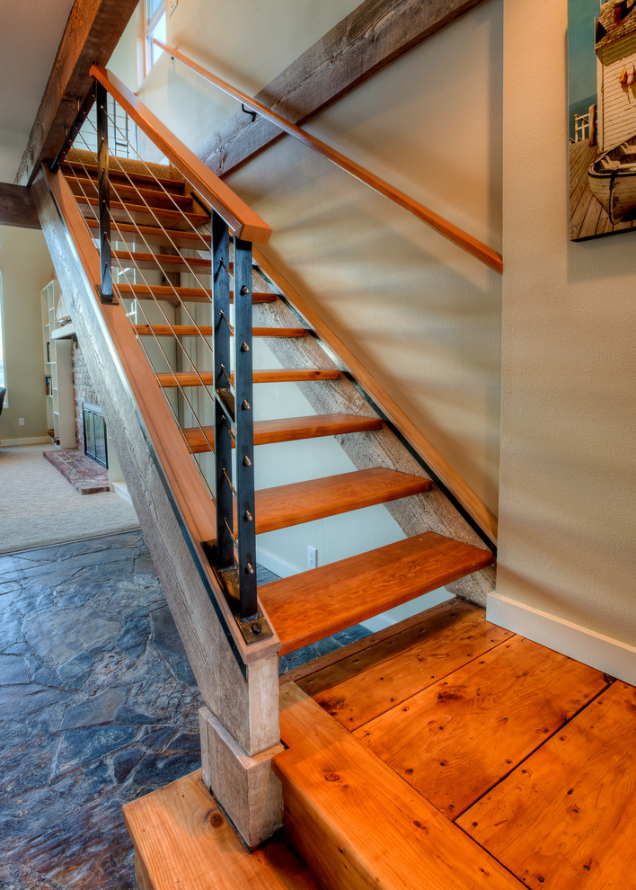 Example of a mid-sized minimalist wooden straight open and metal railing staircase design in Seattle