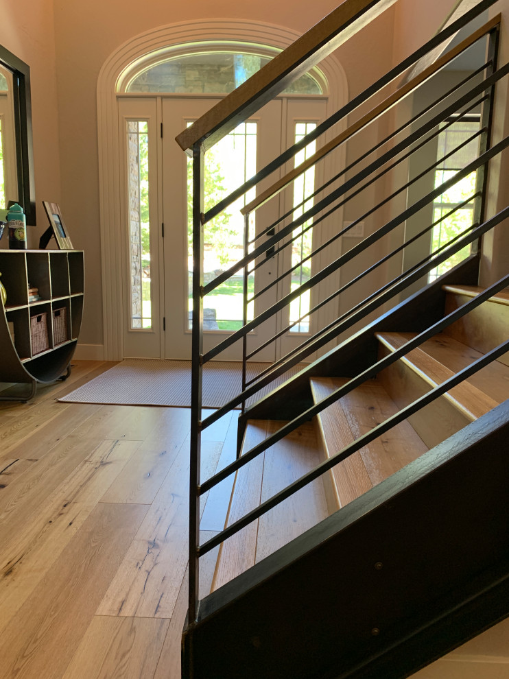 Inspiration for a cottage wooden straight metal railing staircase remodel in Phoenix with wooden risers