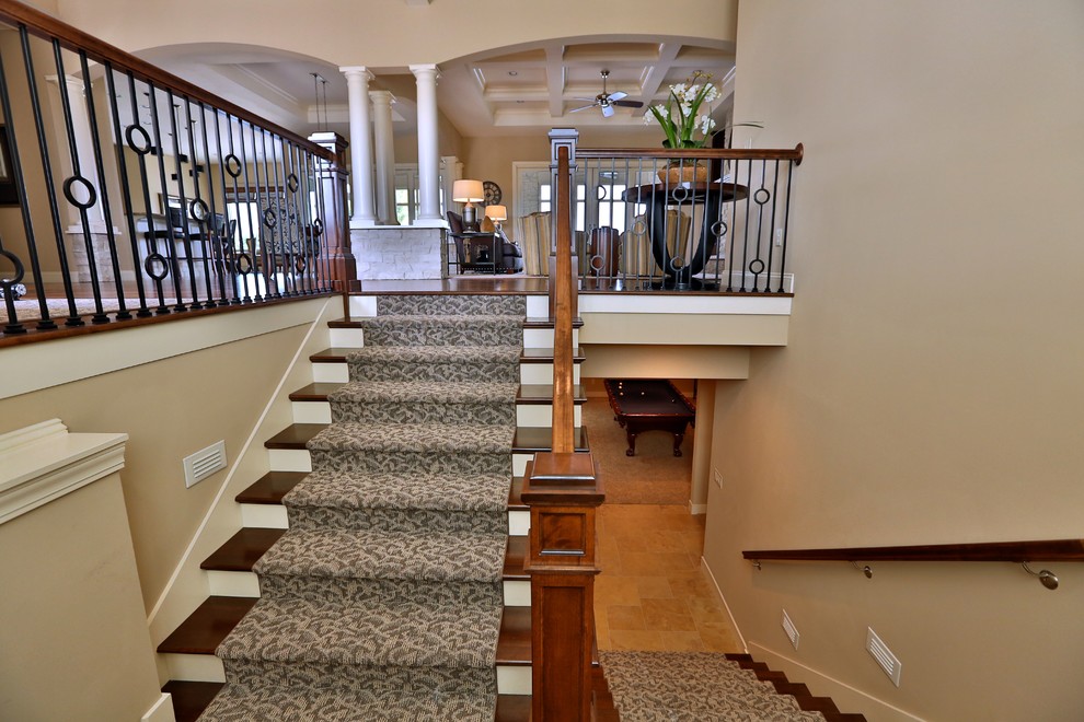Inspiration for a mid-sized timeless carpeted u-shaped staircase remodel in Chicago with wooden risers
