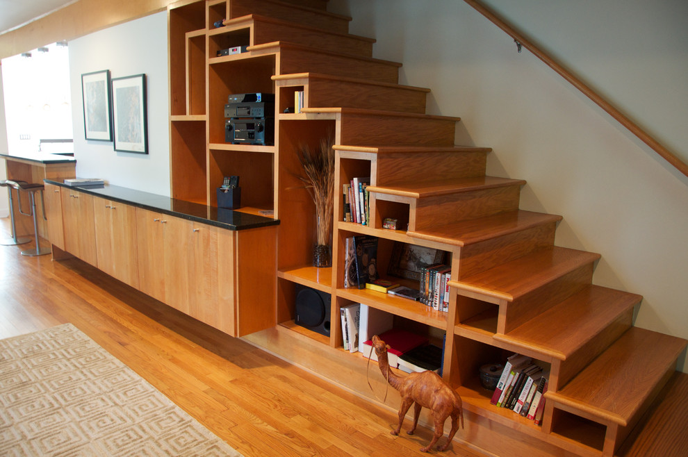 Photo of a medium sized contemporary wood straight staircase in Jackson with wood risers.