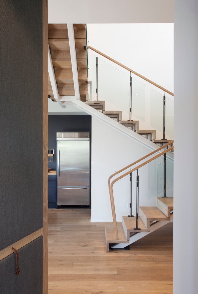 Example of a trendy wooden staircase design in Other with wooden risers
