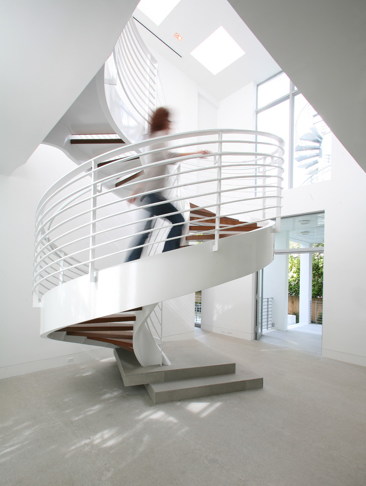 Photo of a contemporary wood spiral staircase in Miami.