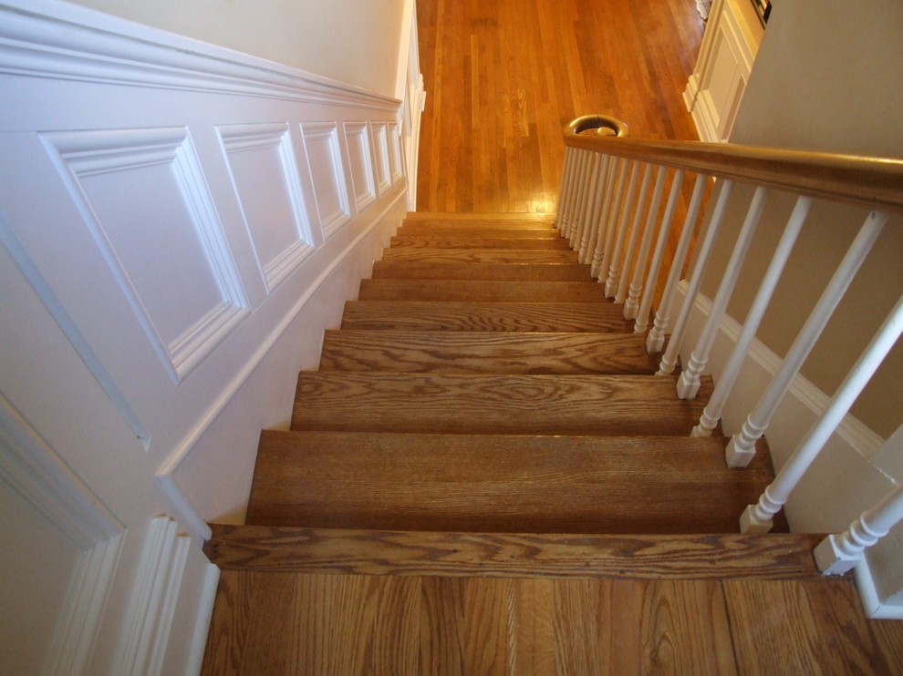 Example of a mid-sized classic wooden u-shaped wood railing staircase design in Newark with wooden risers