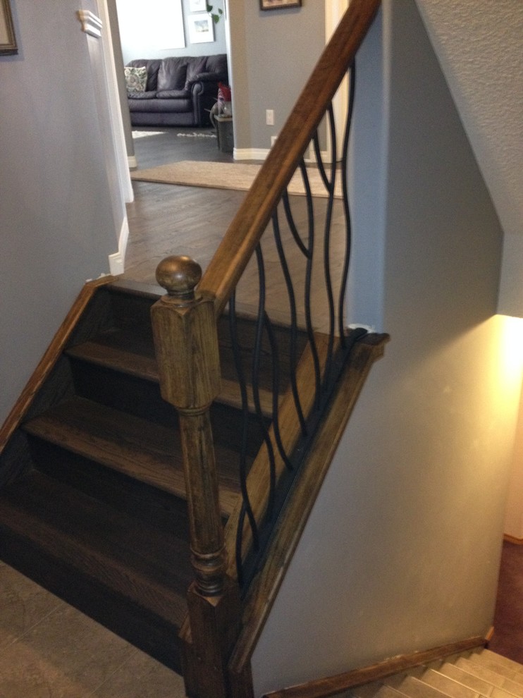 BENT iron design interior railing with a distressed wood handrail and ...