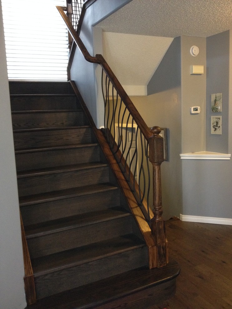 BENT iron design interior railing with a distressed wood handrail and ...