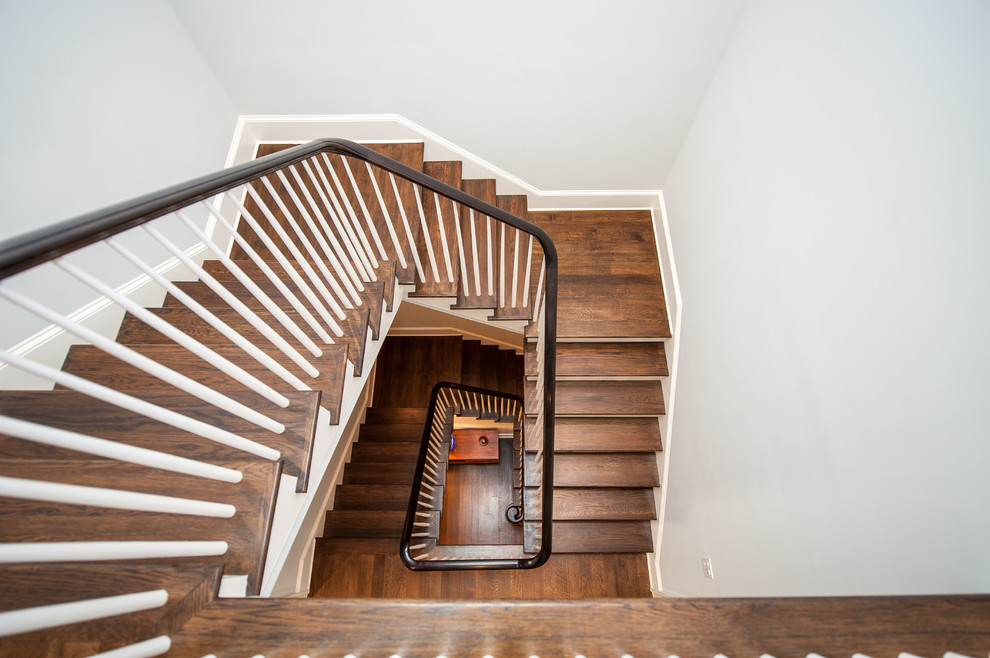 Inspiration for a large contemporary wooden curved staircase remodel in DC Metro with wooden risers