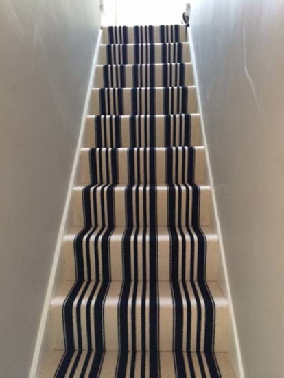 Contemporary carpeted u-shaped staircase in London with carpeted risers.