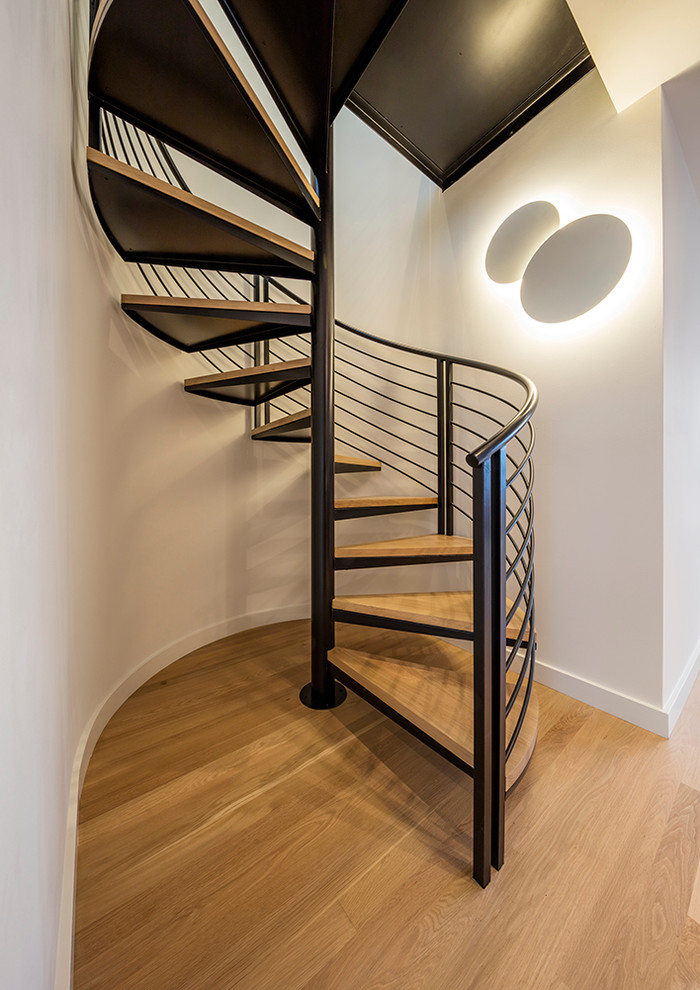 Small trendy wooden spiral open staircase photo in San Francisco