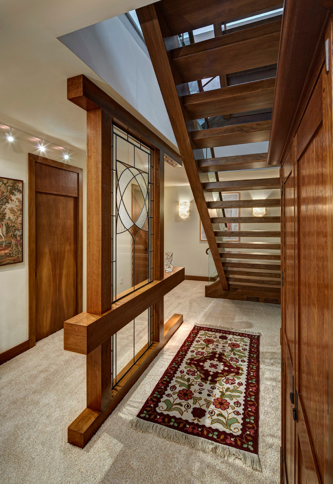 Design ideas for a contemporary wood straight staircase in Detroit with open risers.