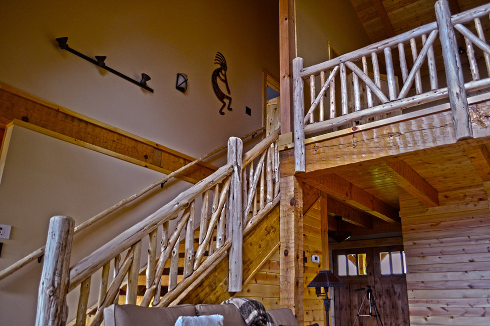 This is an example of a medium sized rustic wood l-shaped staircase in Charlotte with wood risers.