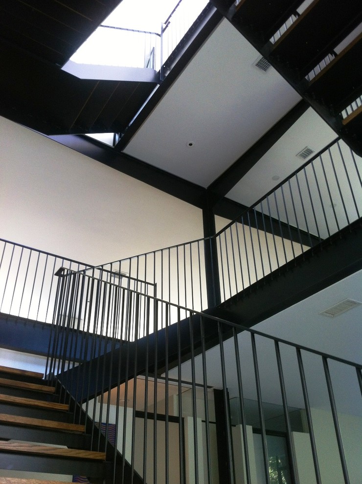 Design ideas for a medium sized contemporary metal l-shaped staircase in Austin with metal risers.