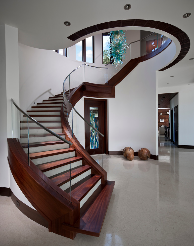 Photo of a contemporary wood staircase in Miami with painted wood risers.