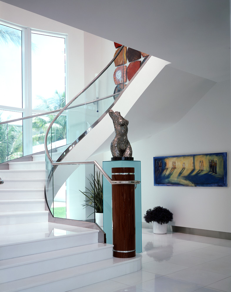 This is an example of a large contemporary curved staircase in Miami.