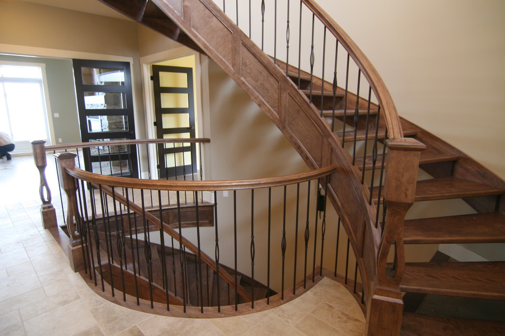 Inspiration pour un escalier sans contremarche courbe minimaliste de taille moyenne avec des marches en bois.