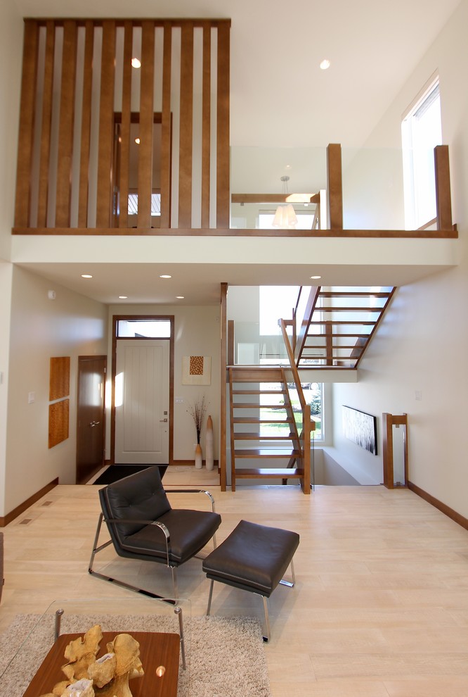 Large modern wood u-shaped staircase in Other with open risers.