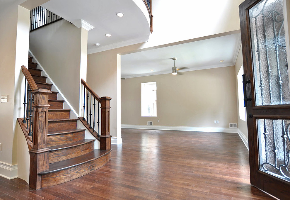 Example of a large classic wooden straight wood railing staircase design in Other with wooden risers