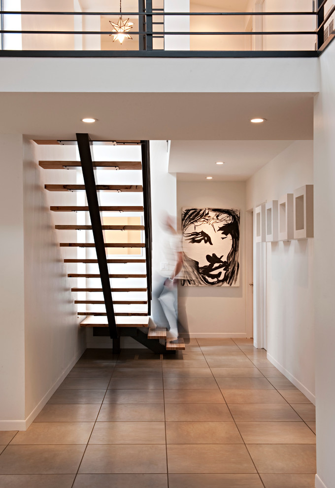 Inspiration for a contemporary wooden open staircase remodel in Austin
