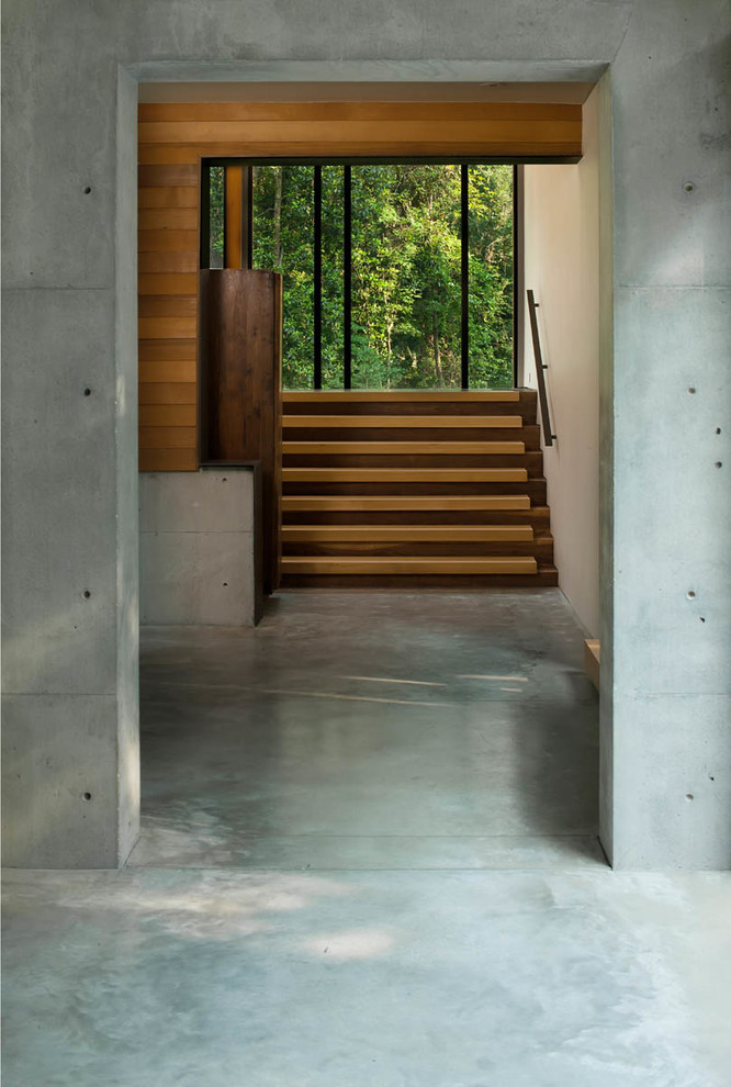 Inspiration pour un grand escalier design en L avec des marches en bois et des contremarches en bois.
