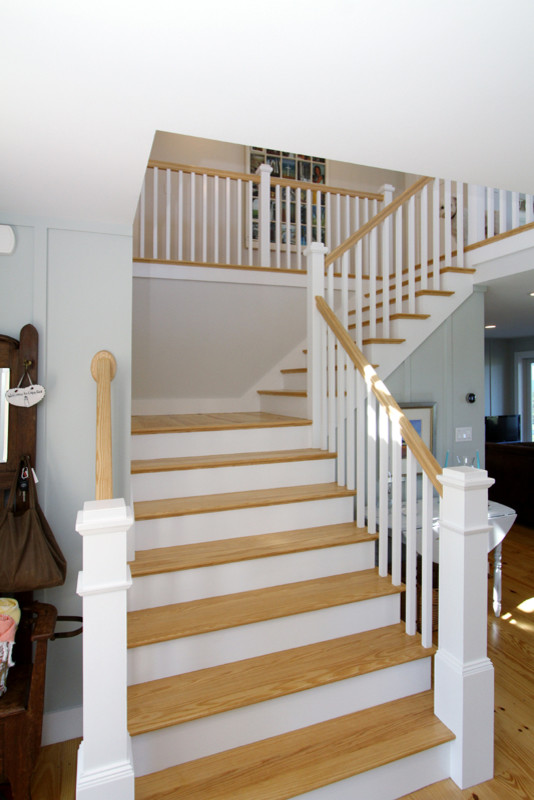 Photo of a medium sized coastal wood curved staircase in Boston with painted wood risers.
