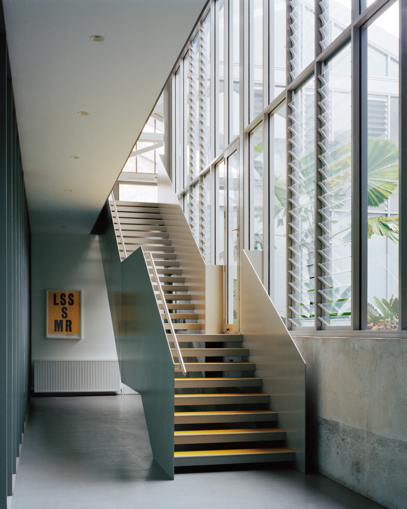 Inspiration for an industrial straight metal railing staircase in Sydney with open risers.