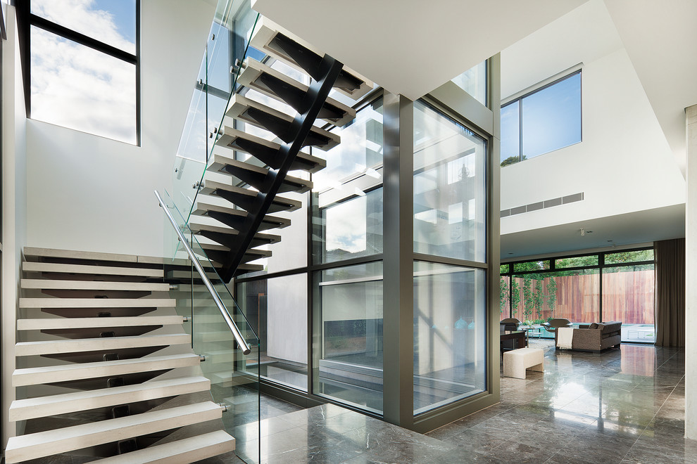 Contemporary u-shaped staircase in Melbourne with open risers.