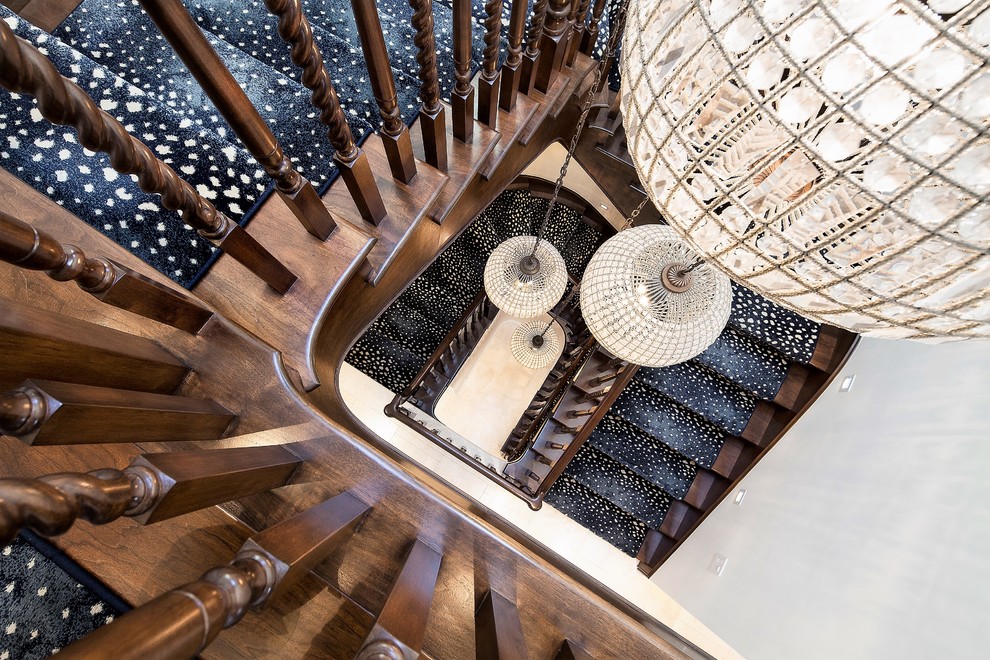 Inspiration for a large nautical wood curved staircase with wood risers.