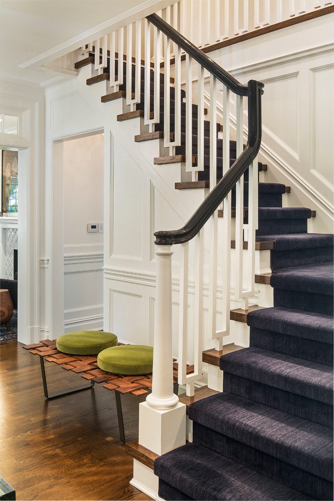Inspiration for a medium sized traditional wood l-shaped staircase in New York with painted wood risers.