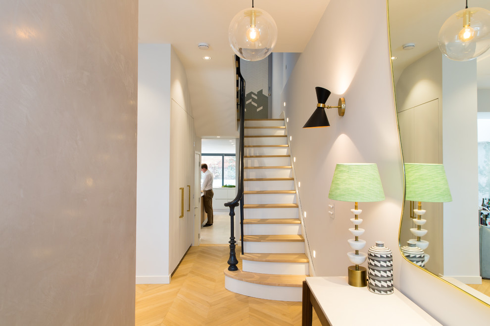 This is an example of a contemporary staircase with feature lighting.