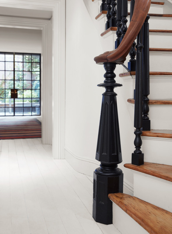 Inspiration for a medium sized classic wood curved wood railing staircase in New York with painted wood risers.