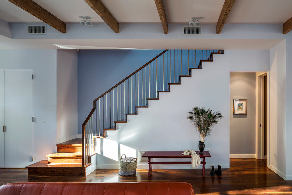 Trendy wooden l-shaped staircase photo in New York with wooden risers