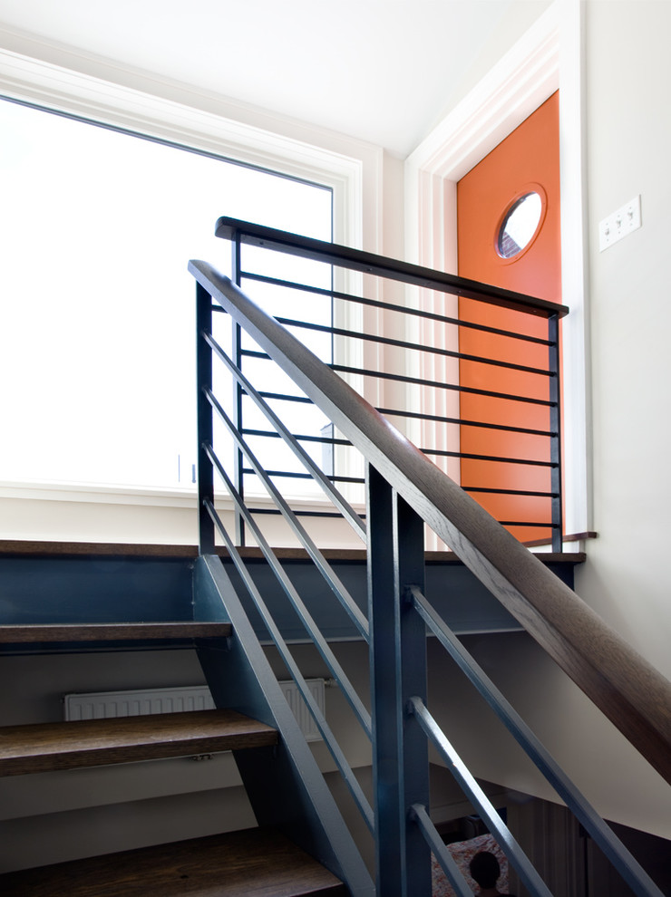 Design ideas for a contemporary staircase in New York with open risers.