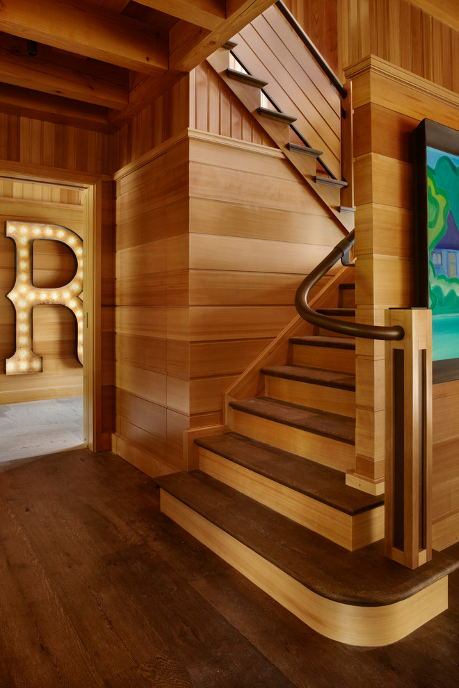 Inspiration for a contemporary wood u-shaped staircase in Minneapolis with wood risers.