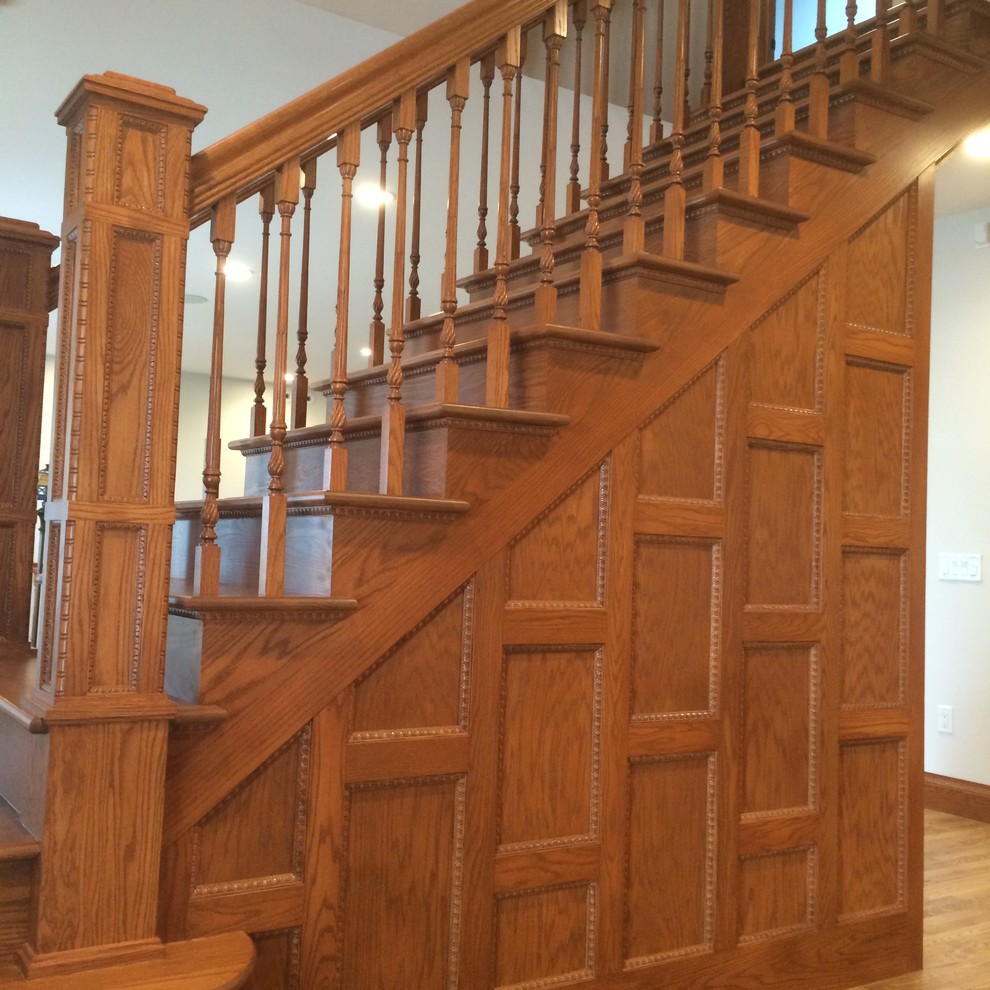 Inspiration for a large rural wood staircase in Chicago with wood risers.