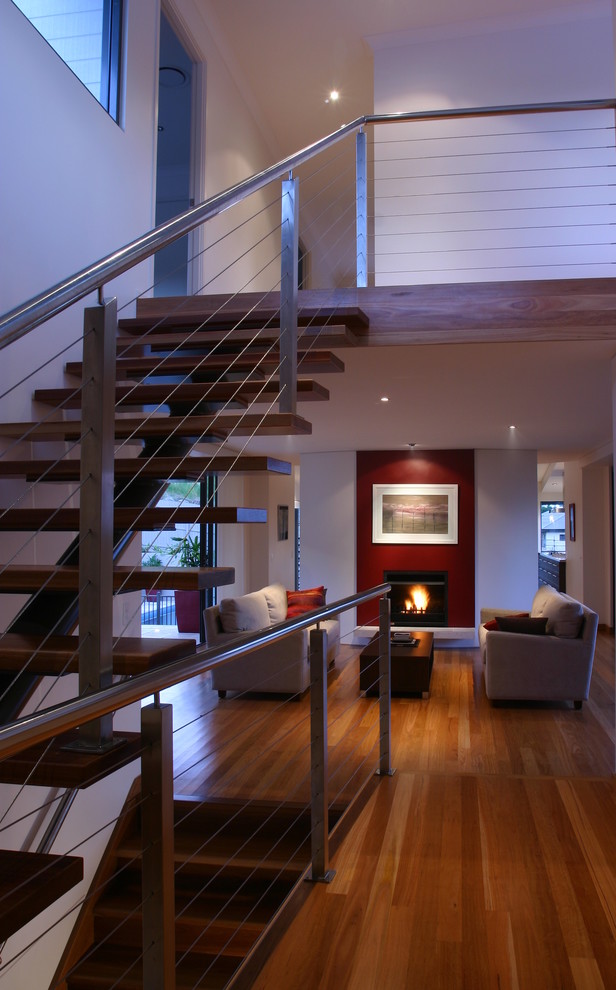Contemporary staircase in Sunshine Coast with feature lighting.