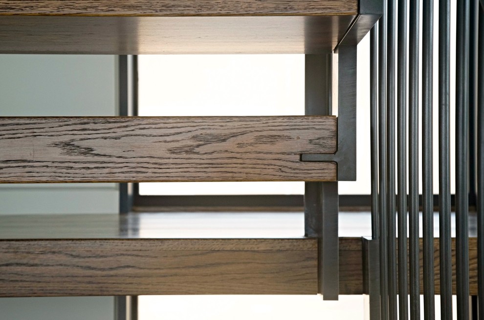 Diseño de escalera en U contemporánea de tamaño medio sin contrahuella con escalones de madera