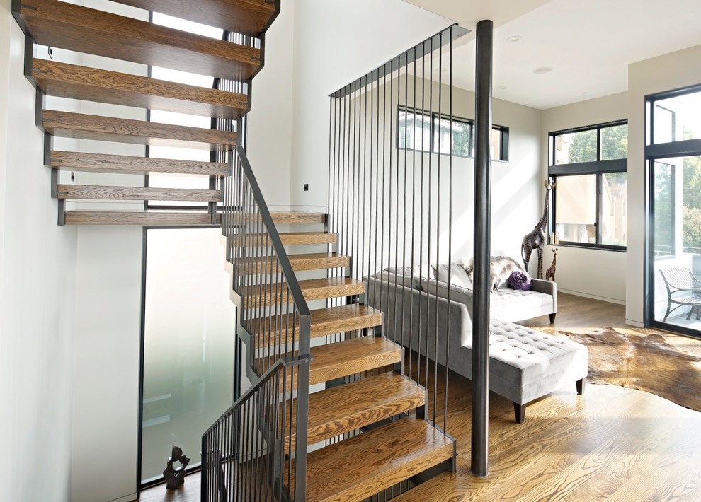 Inspiration pour un escalier sans contremarche design en U de taille moyenne avec des marches en bois.
