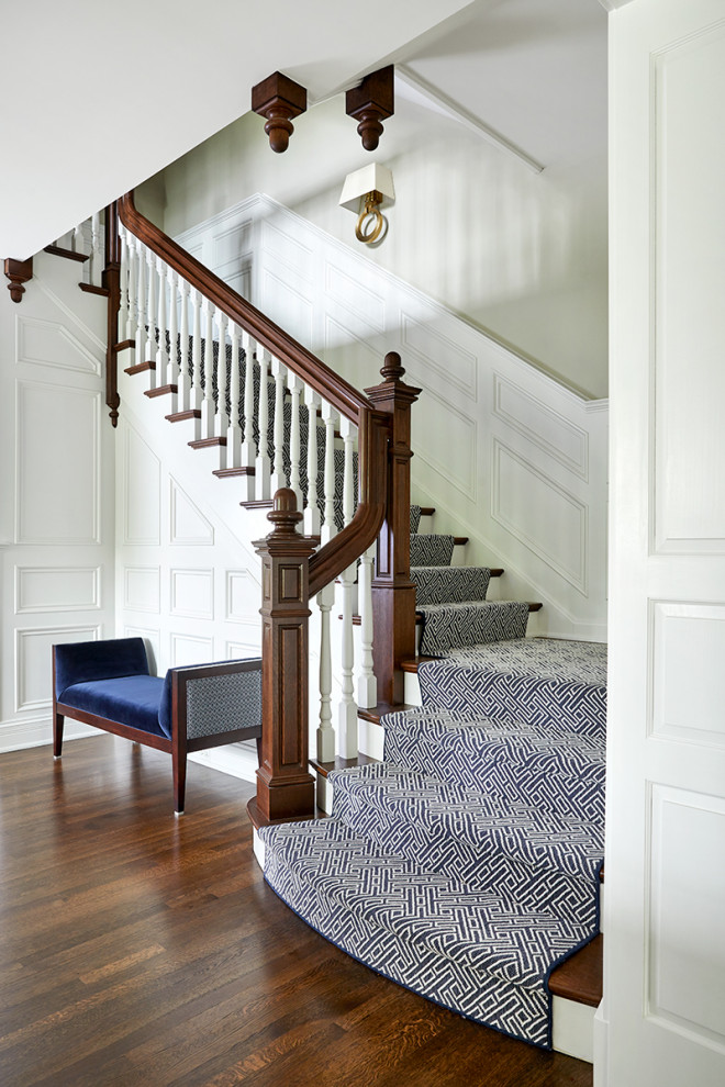 Inspiration for a timeless wooden l-shaped wood railing and wainscoting staircase remodel in Chicago with painted risers