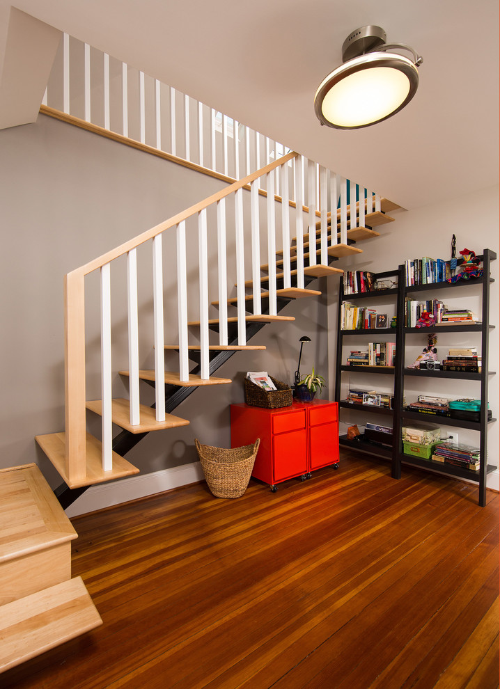 Example of a mid-sized transitional wooden floating open staircase design in DC Metro