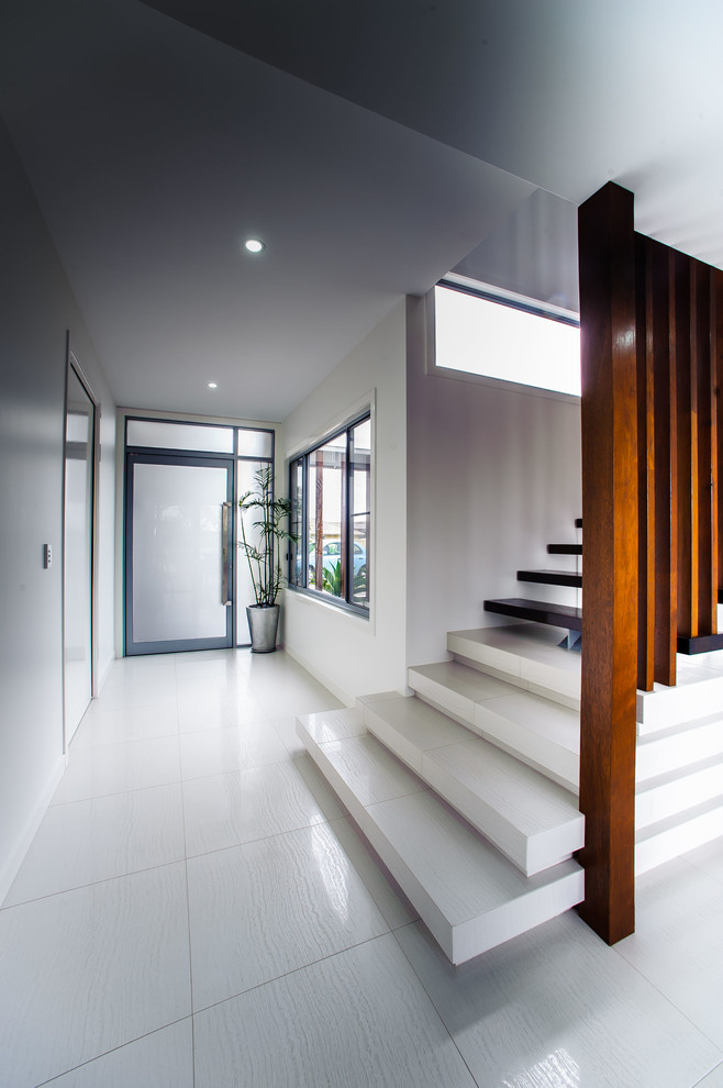 Inspiration for a contemporary straight open staircase remodel in Brisbane