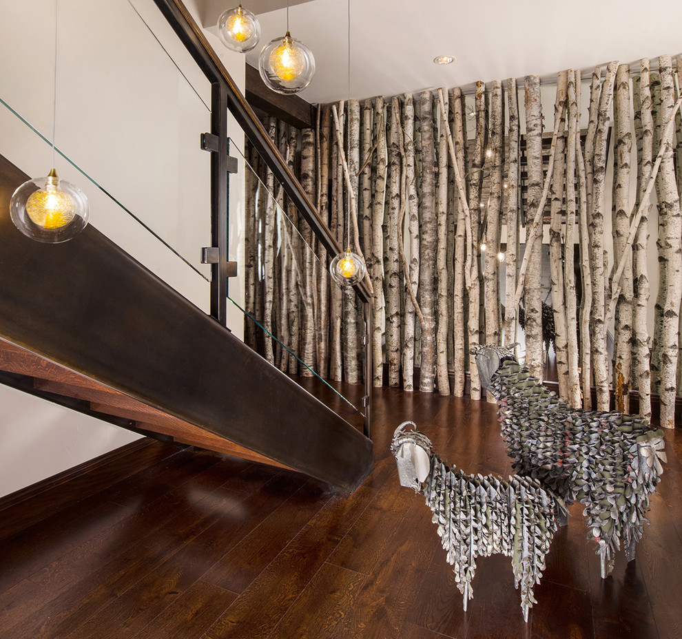 Example of a trendy wooden l-shaped open and glass railing staircase design in Denver