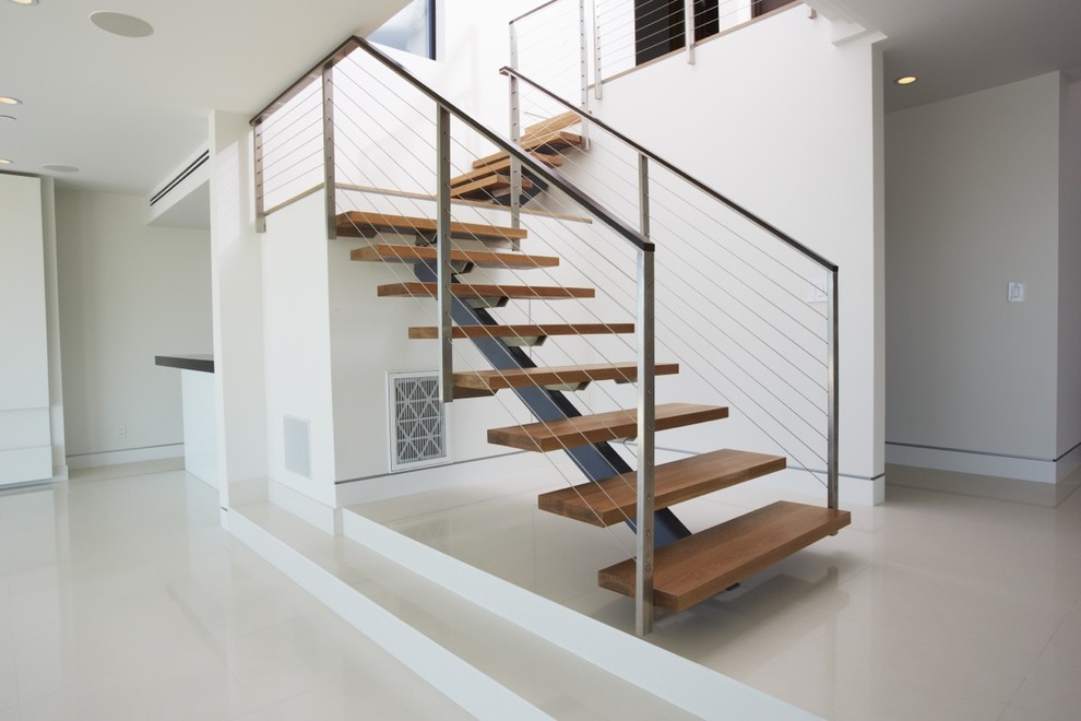 Staircase - contemporary wooden floating open staircase idea in Los Angeles