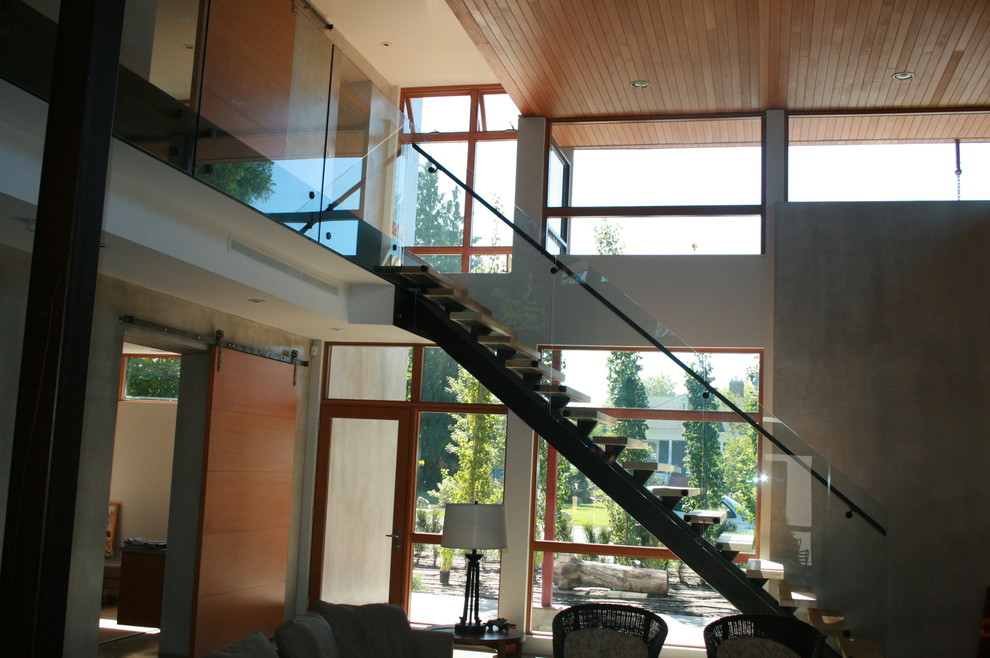 Staircase - mid-sized modern wooden floating open staircase idea in Vancouver