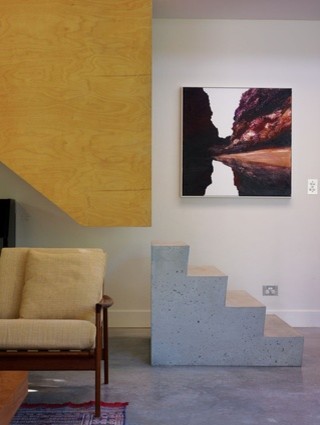This is an example of a medium sized contemporary concrete straight staircase in Sydney.
